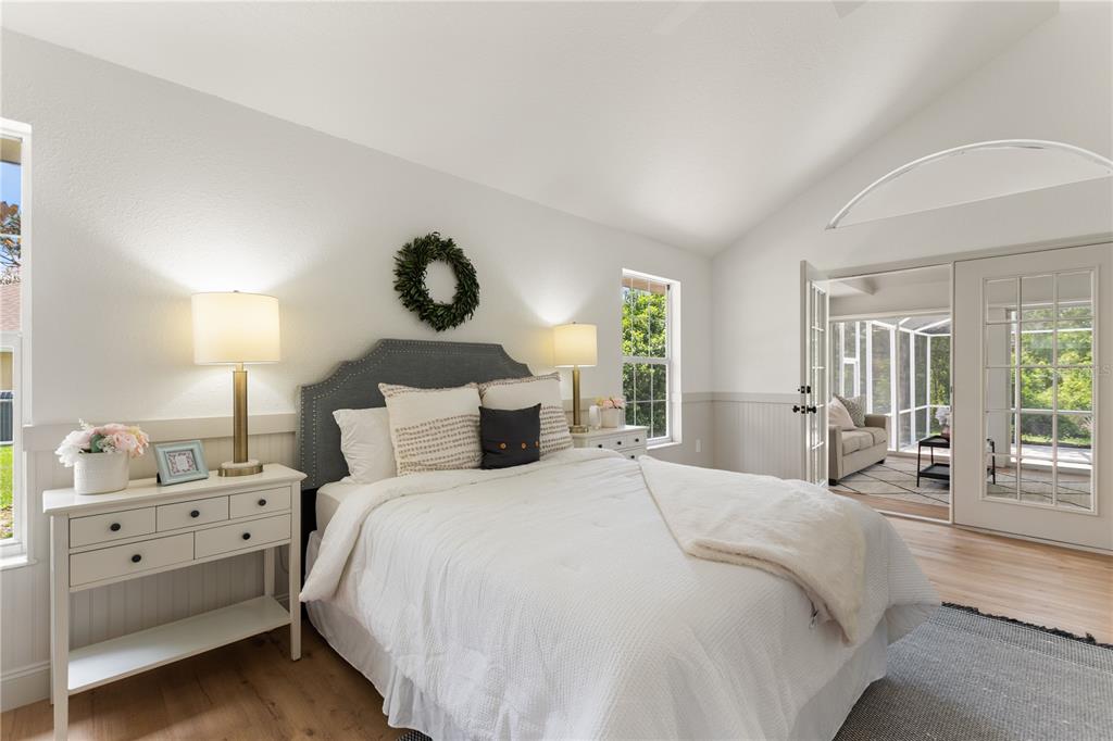 419 Silas Court Spring Hill, FL 34609 - Photo 26 of 56 a bedroom with a large bed and a window