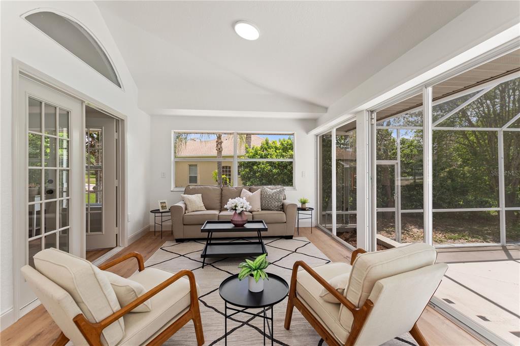 419 Silas Court Spring Hill, FL 34609 - Photo 31 of 56 a living room with furniture and a large window