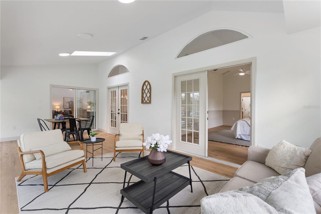 419 Silas Court Spring Hill, FL 34609 - Photo 32 of 56 a living room with furniture and a glass door