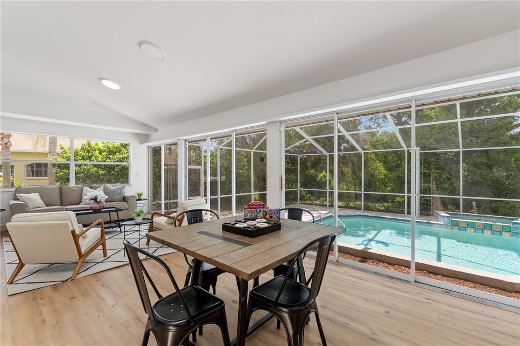 419 Silas Court Spring Hill, FL 34609 - Photo 34 of 56 a view of a dining room with furniture window and wooden floor