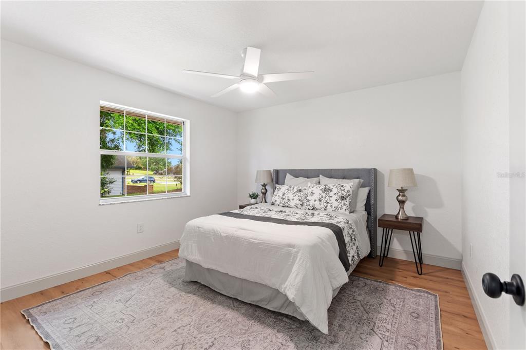 419 Silas Court Spring Hill, FL 34609 - Photo 36 of 56 a bedroom with a bed and a window