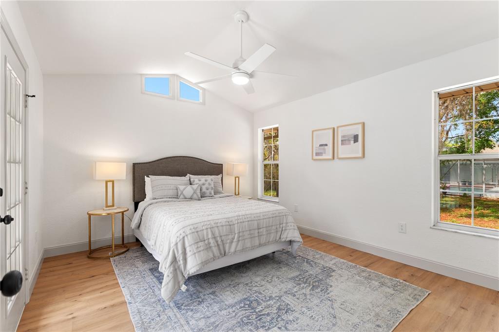 419 Silas Court Spring Hill, FL 34609 - Photo 40 of 56 a bedroom with a bed and a window