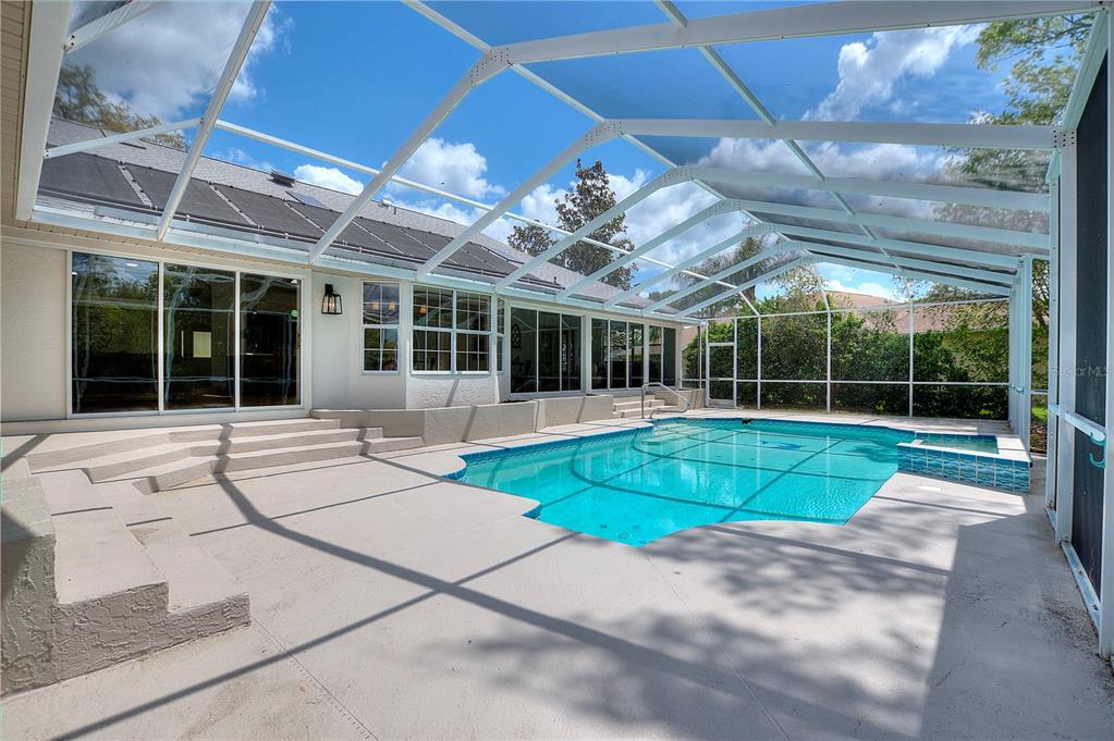 419 Silas Court Spring Hill, FL 34609 - Photo 4 of 56 a view of a house with a backyard and a patio