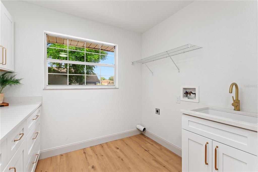 419 Silas Court Spring Hill, FL 34609 - Photo 43 of 56 a room with a sink and a window