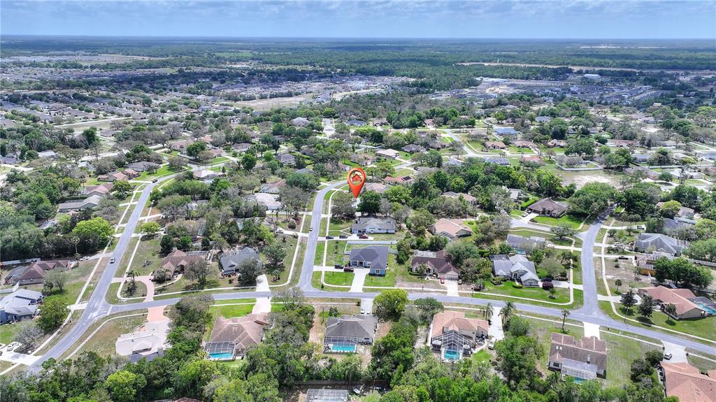 419 Silas Court Spring Hill, FL 34609 - Photo 53 of 56 an aerial view of residential houses with outdoor space and trees