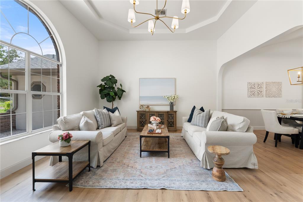 419 Silas Court Spring Hill, FL 34609 - Photo 6 of 56 a living room with furniture and a large window
