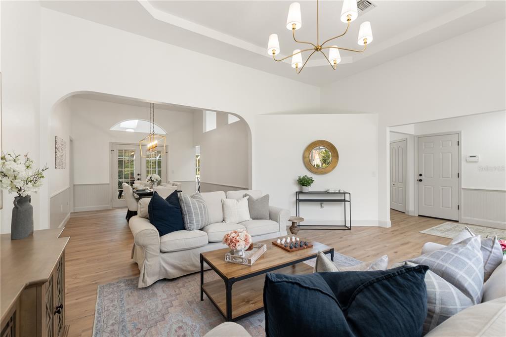 419 Silas Court Spring Hill, FL 34609 - Photo 7 of 56 a living room with furniture and a table