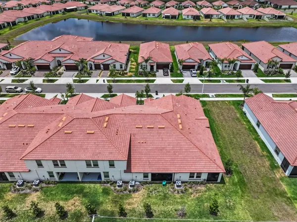 an aerial view of house with yard