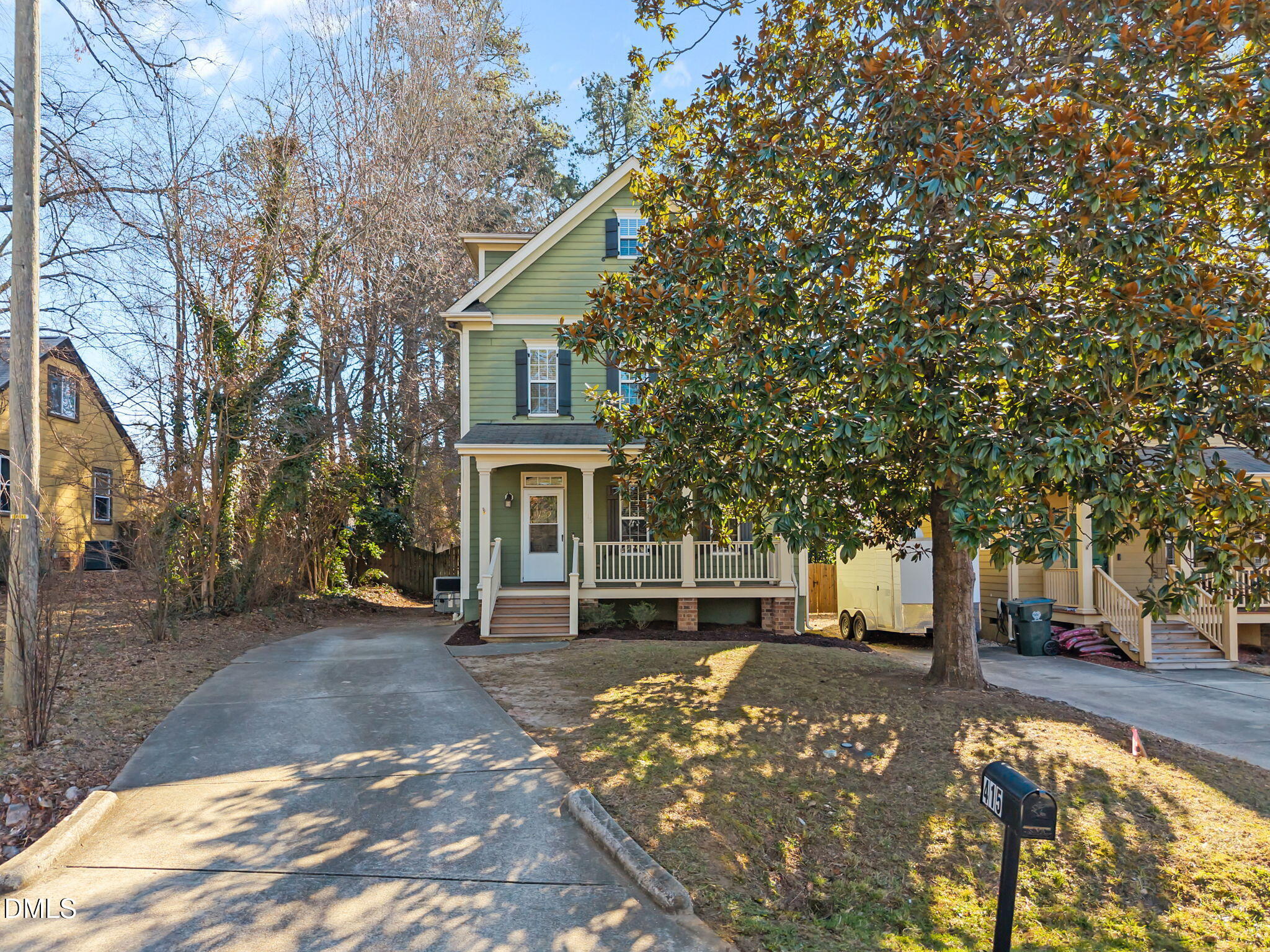 415 Carolina Avenue Raleigh, NC 27606 - Photo 11 of 58 a front view of a house with a yard