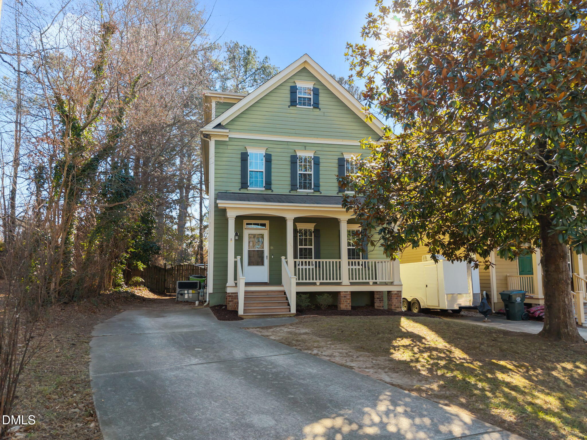 415 Carolina Avenue Raleigh, NC 27606 - Photo 13 of 58 a front view of a house with a yard and garage
