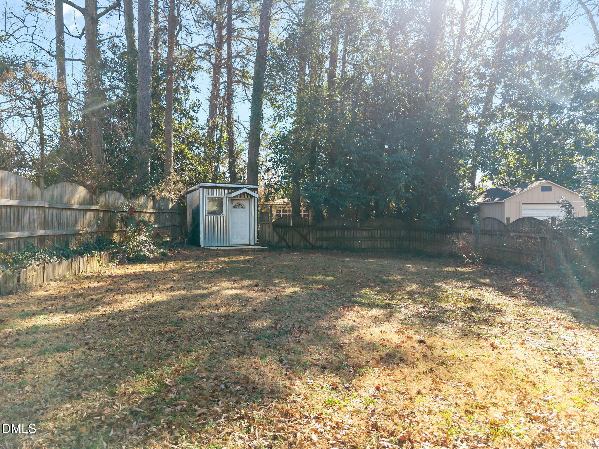 415 Carolina Avenue Raleigh, NC 27606 - Photo 18 of 58 a backyard of a house with lots of green space