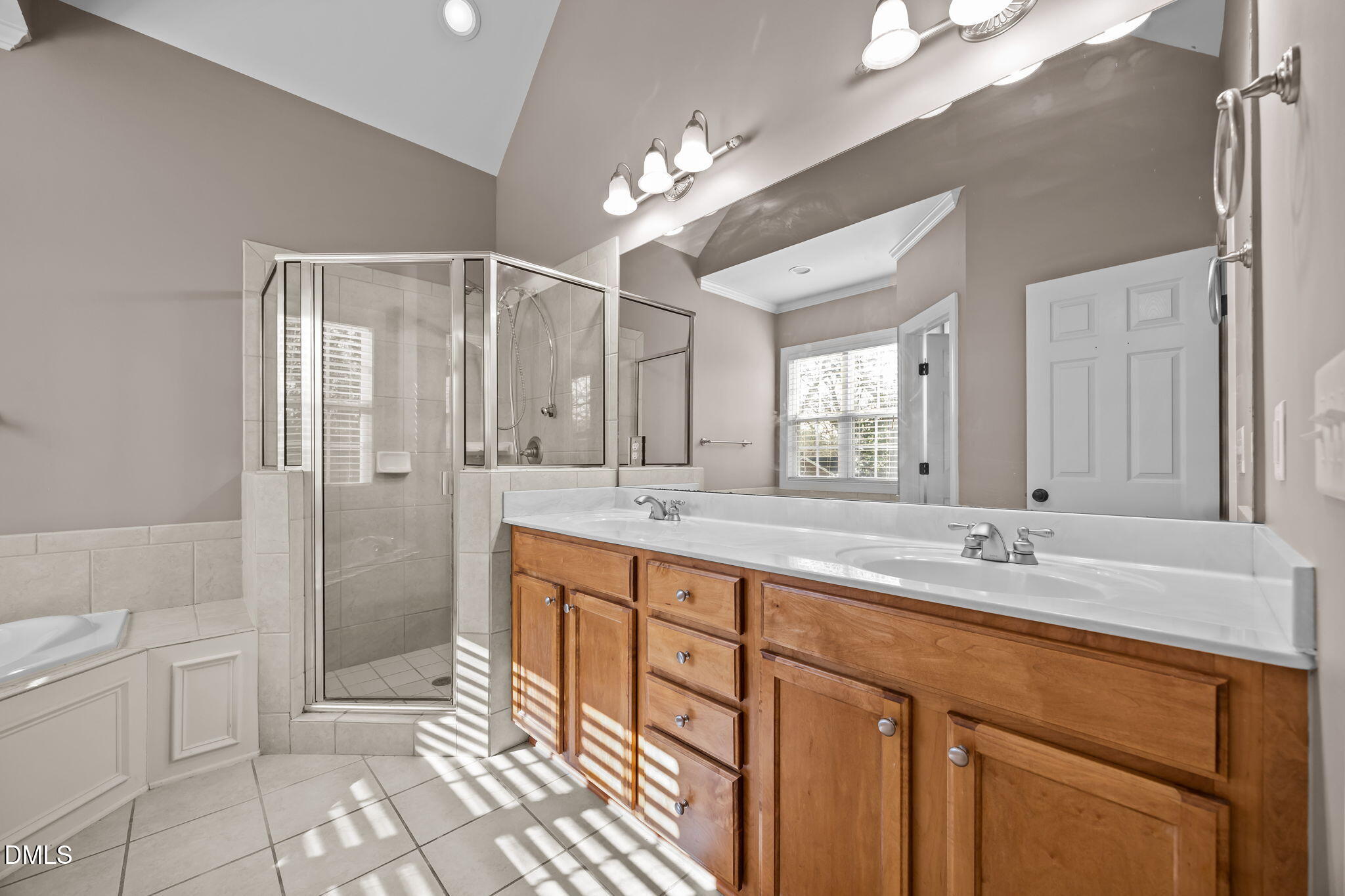 415 Carolina Avenue Raleigh, NC 27606 - Photo 33 of 58 a spacious bathroom with a granite countertop sink a toilet a mirror and shower