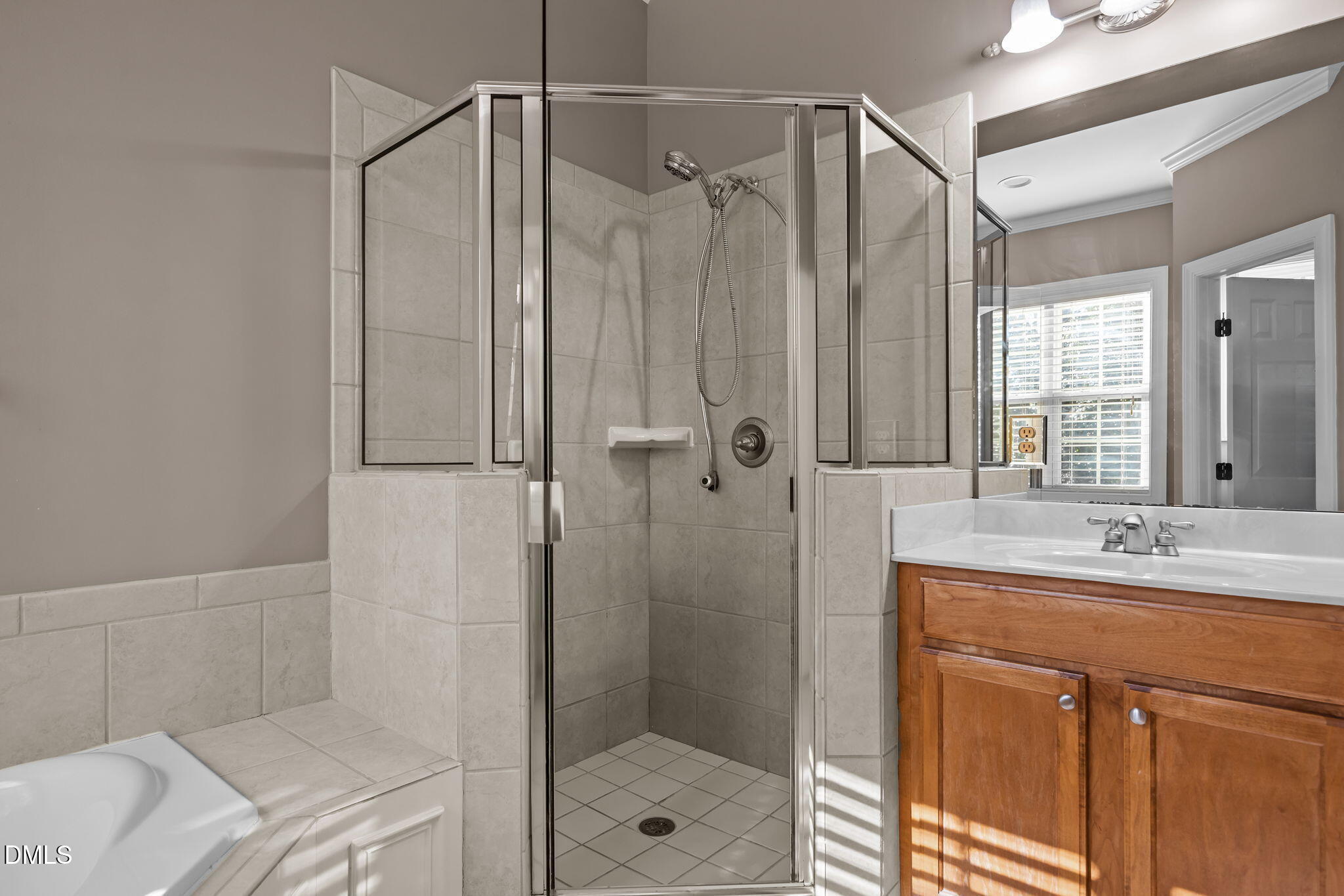 415 Carolina Avenue Raleigh, NC 27606 - Photo 35 of 58 a bathroom with a shower and a sink