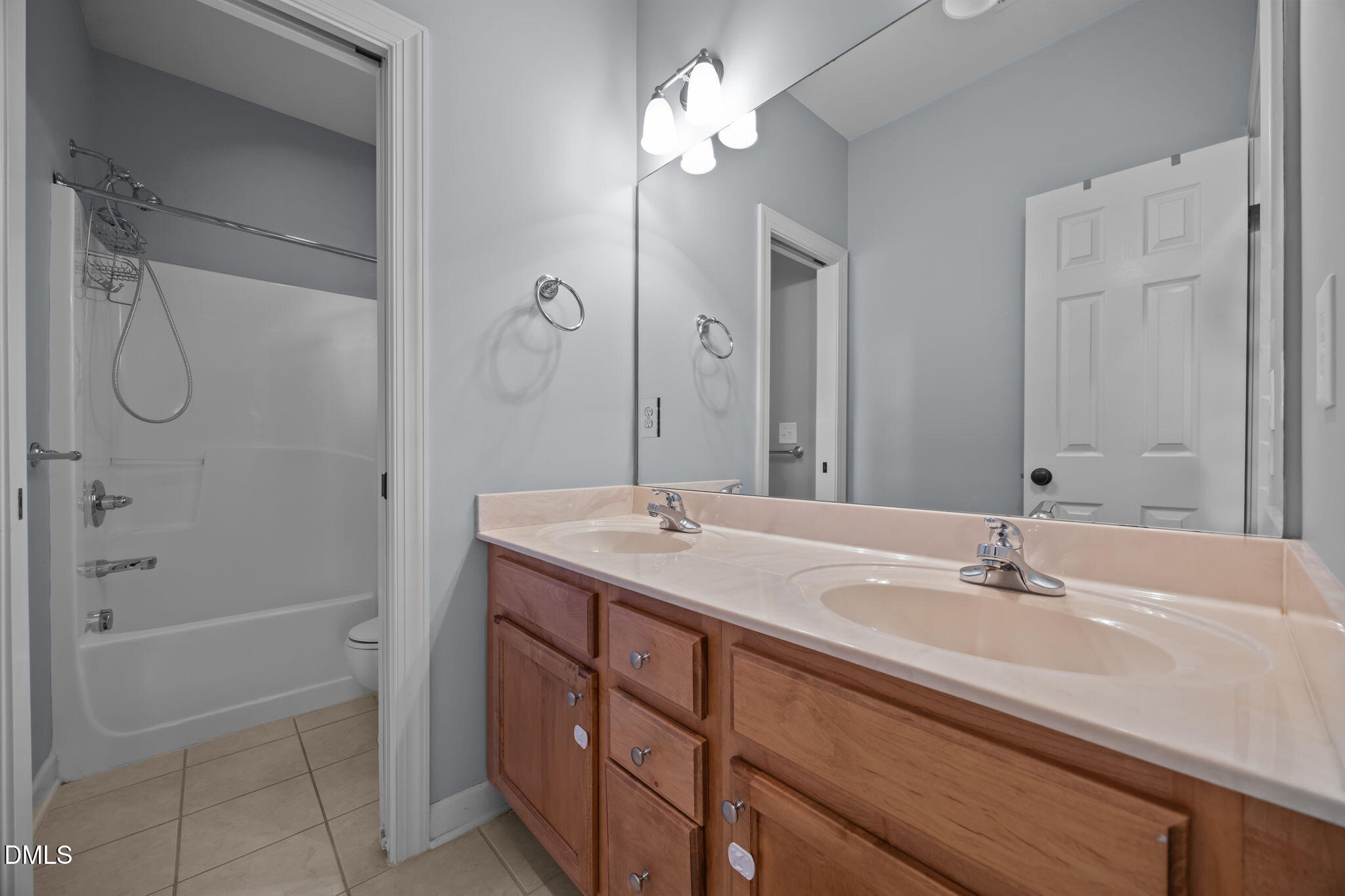 415 Carolina Avenue Raleigh, NC 27606 - Photo 36 of 58 a bathroom with a sink double vanity granite tub and shower