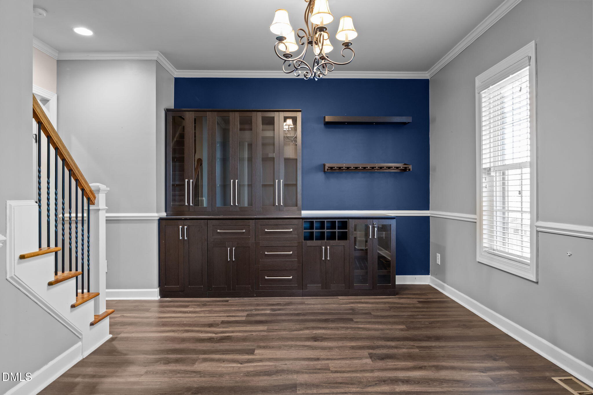 415 Carolina Avenue Raleigh, NC 27606 - Photo 41 of 58 a view of a hallway with wooden floor and staircase
