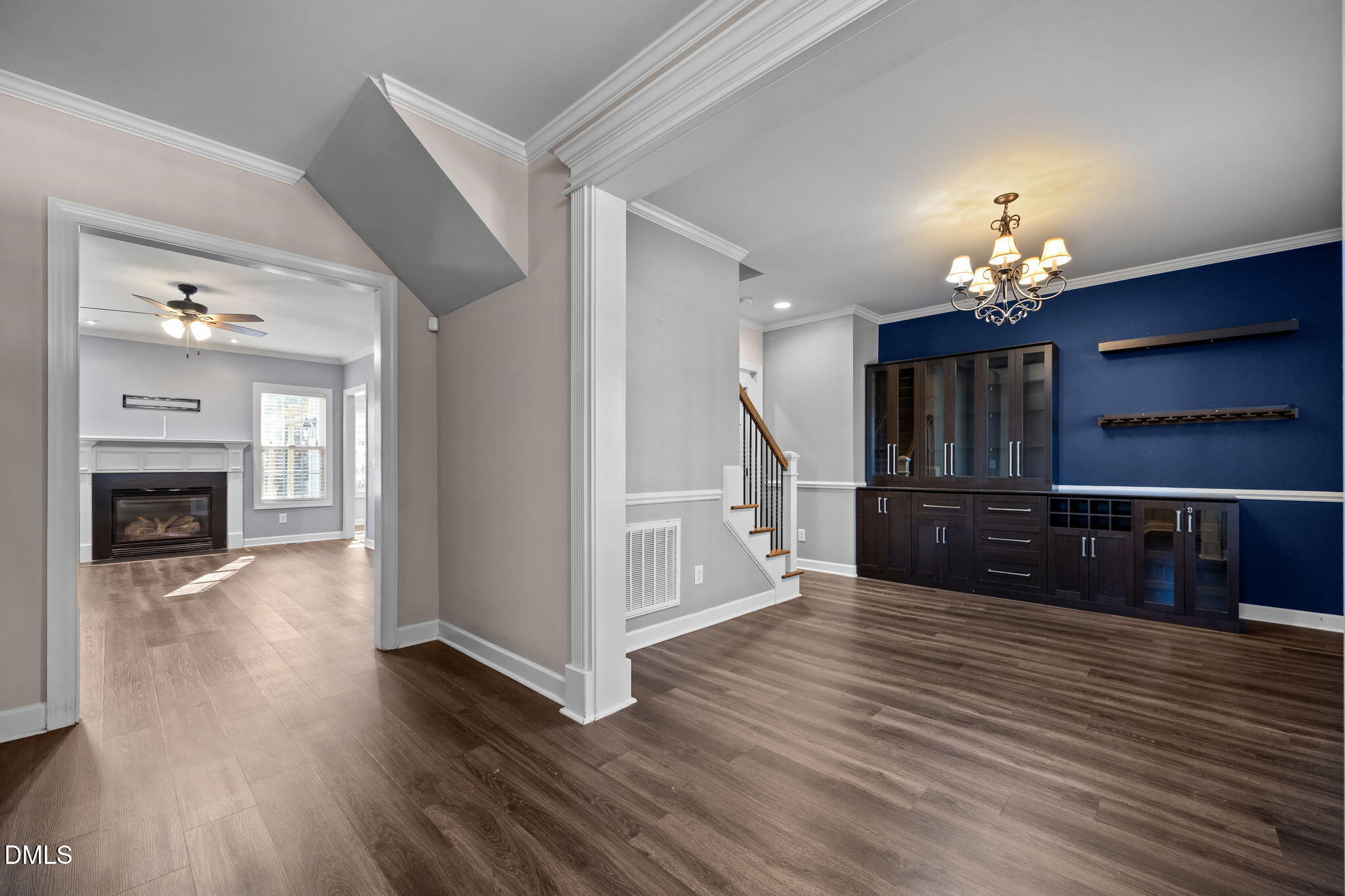 415 Carolina Avenue Raleigh, NC 27606 - Photo 44 of 58 a view of a room with wooden floor and a fireplace