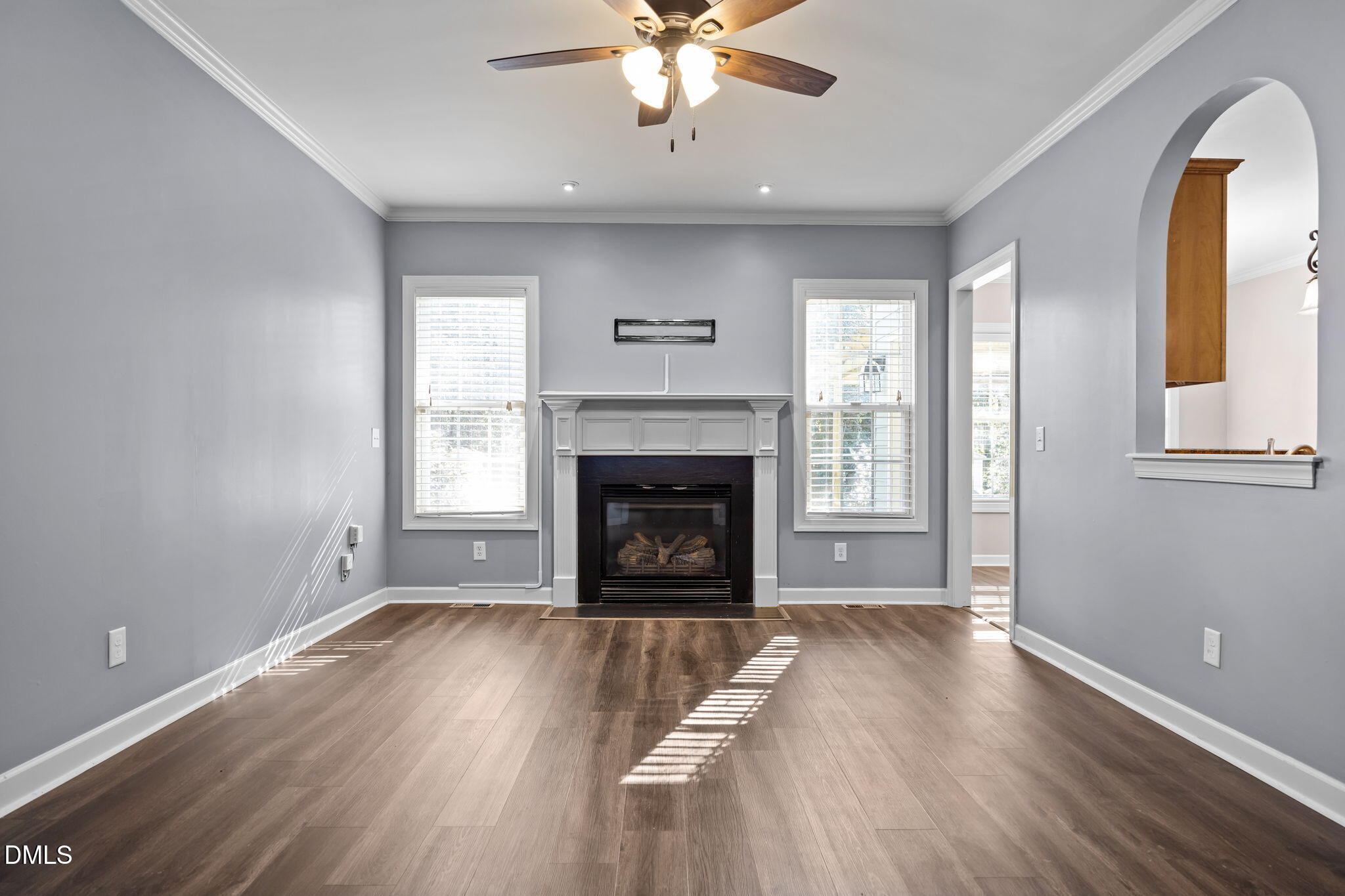 415 Carolina Avenue Raleigh, NC 27606 - Photo 46 of 58 a view of an empty room with wooden floor fireplace and a window