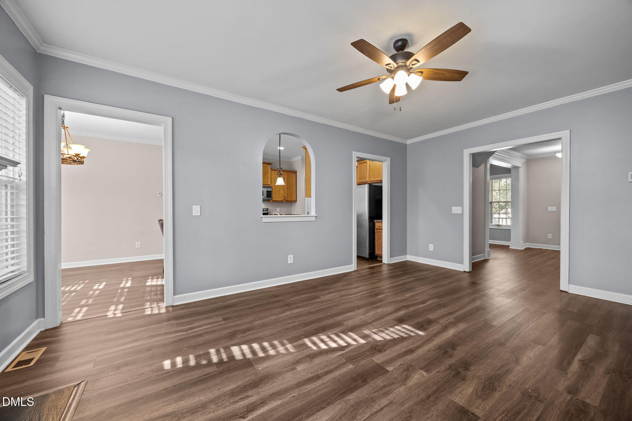 415 Carolina Avenue Raleigh, NC 27606 - Photo 48 of 58 a view of an empty room with window and wooden floor