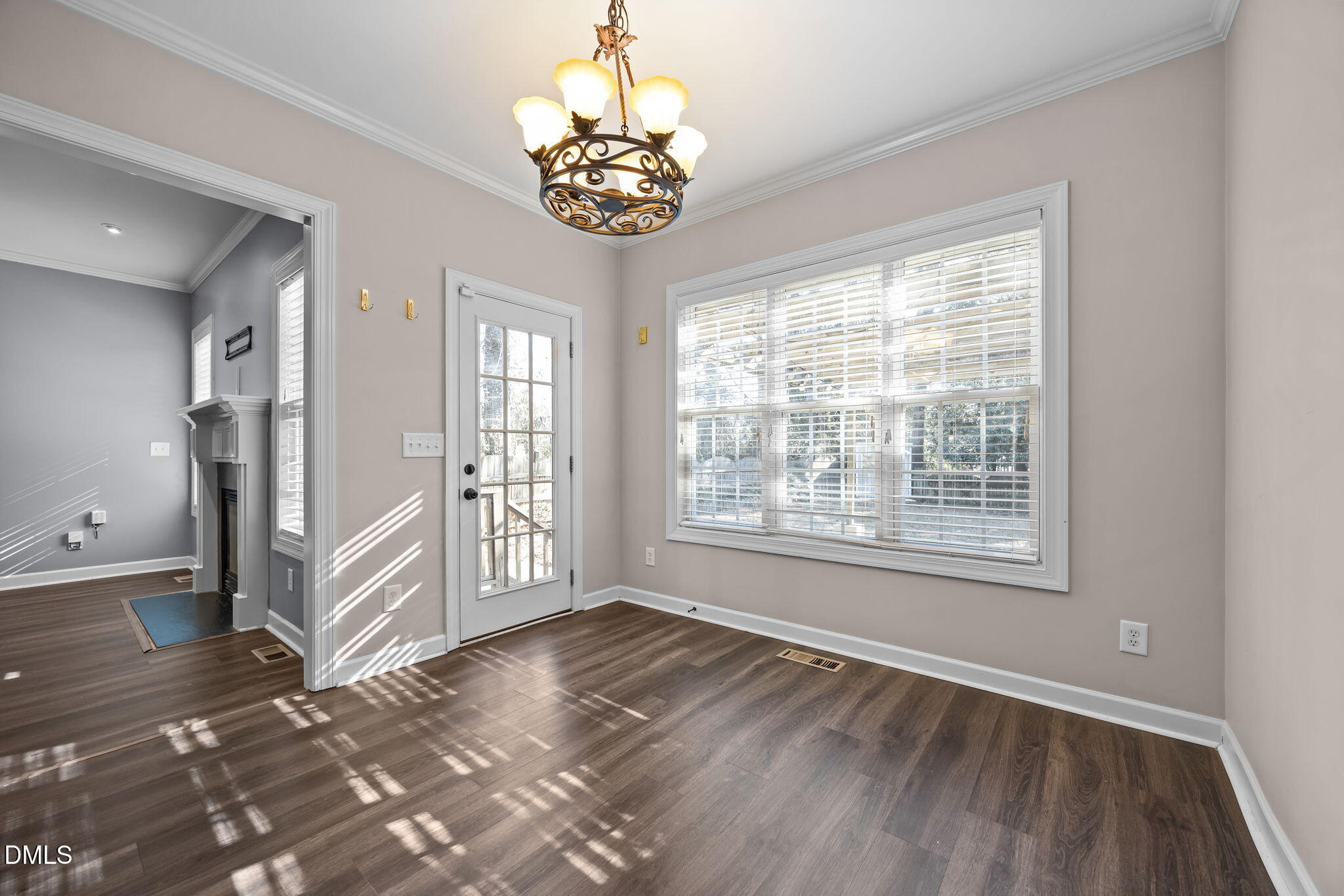 415 Carolina Avenue Raleigh, NC 27606 - Photo 52 of 58 a view of an empty room with a window and wooden floor