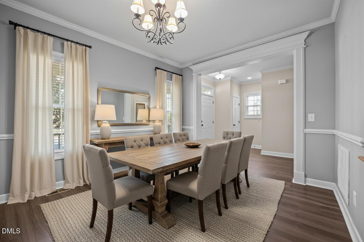 415 Carolina Avenue Raleigh, NC 27606 - Photo 5 of 58 a view of a dining room with furniture window and wooden floor