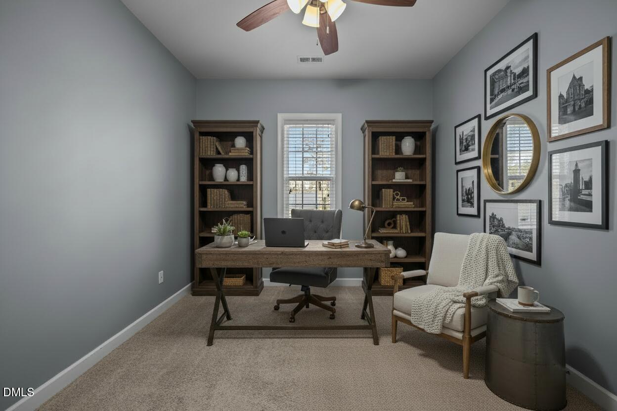 415 Carolina Avenue Raleigh, NC 27606 - Photo 6 of 58 a view of a livingroom with workspace and a couch