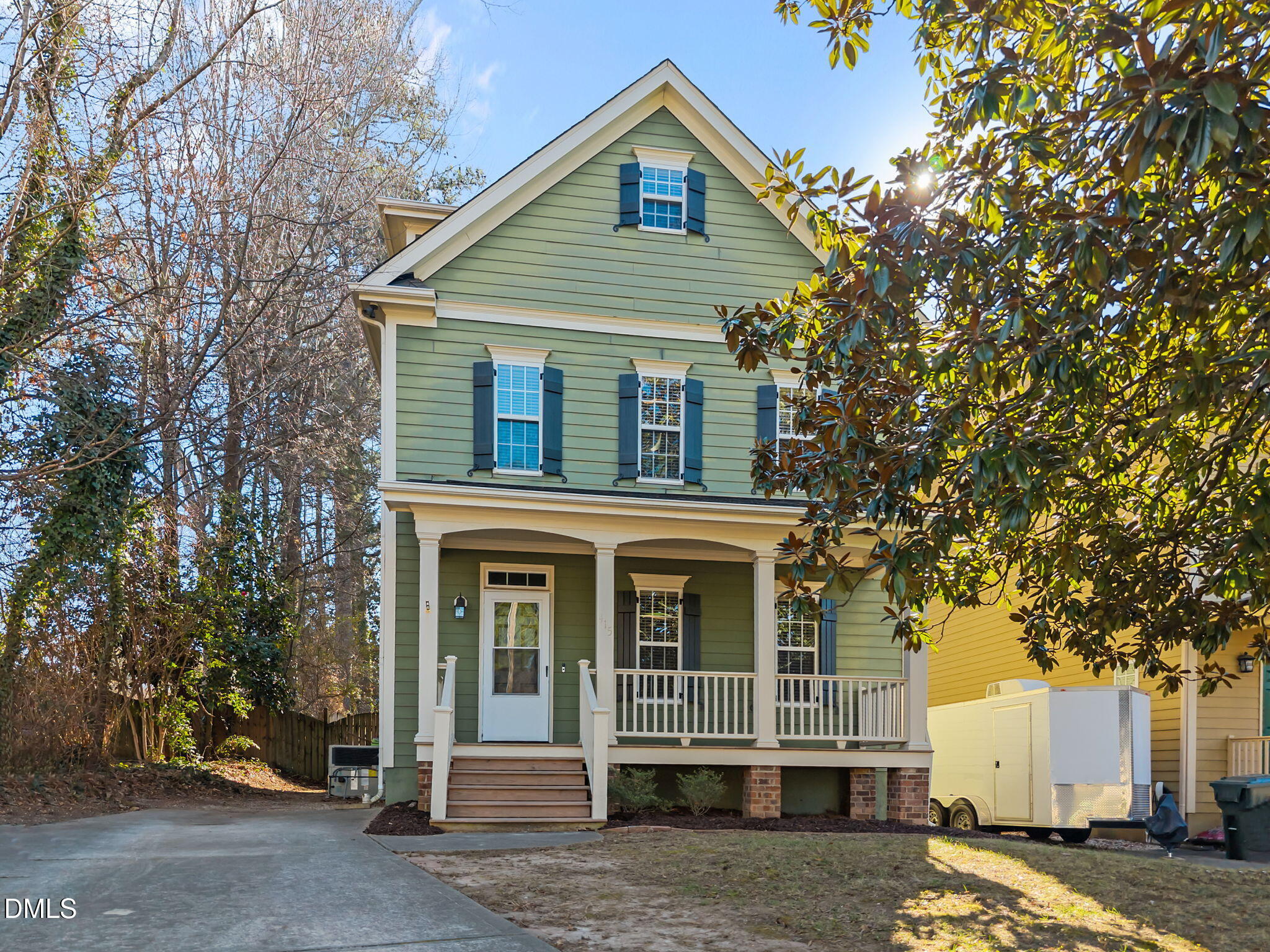 415 Carolina Avenue Raleigh, NC 27606 - Photo 9 of 58 a front view of a house with a tree