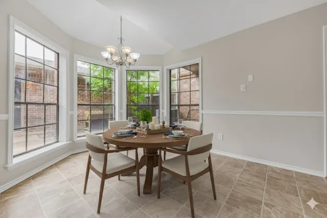 a view of a dining room with furniture window and outside view