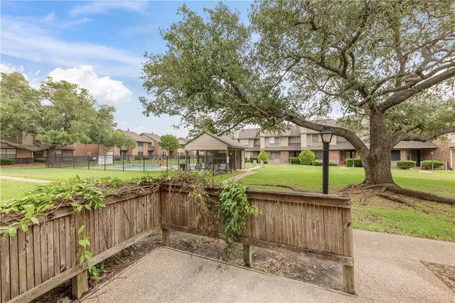 a view of a wrought iron fences in front of house