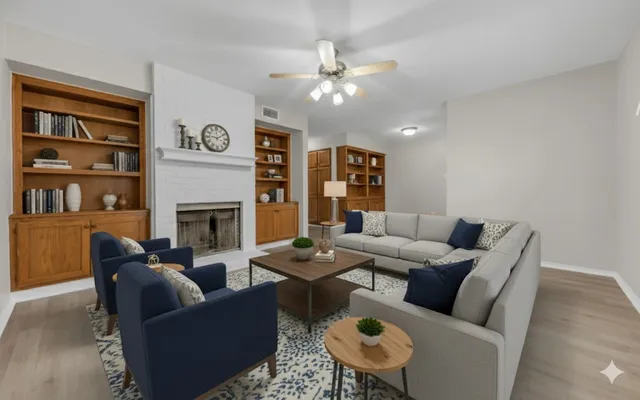 a living room with furniture and a fireplace