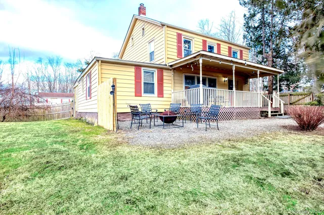 a front view of house with yard porch and sitting area