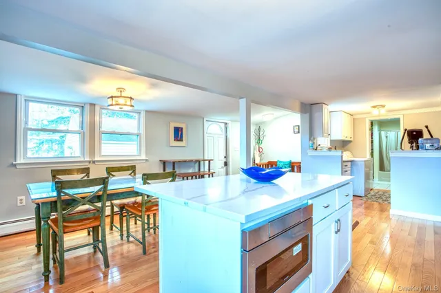 a view of a kitchen and dining room