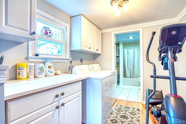 a kitchen with a sink cabinets and window