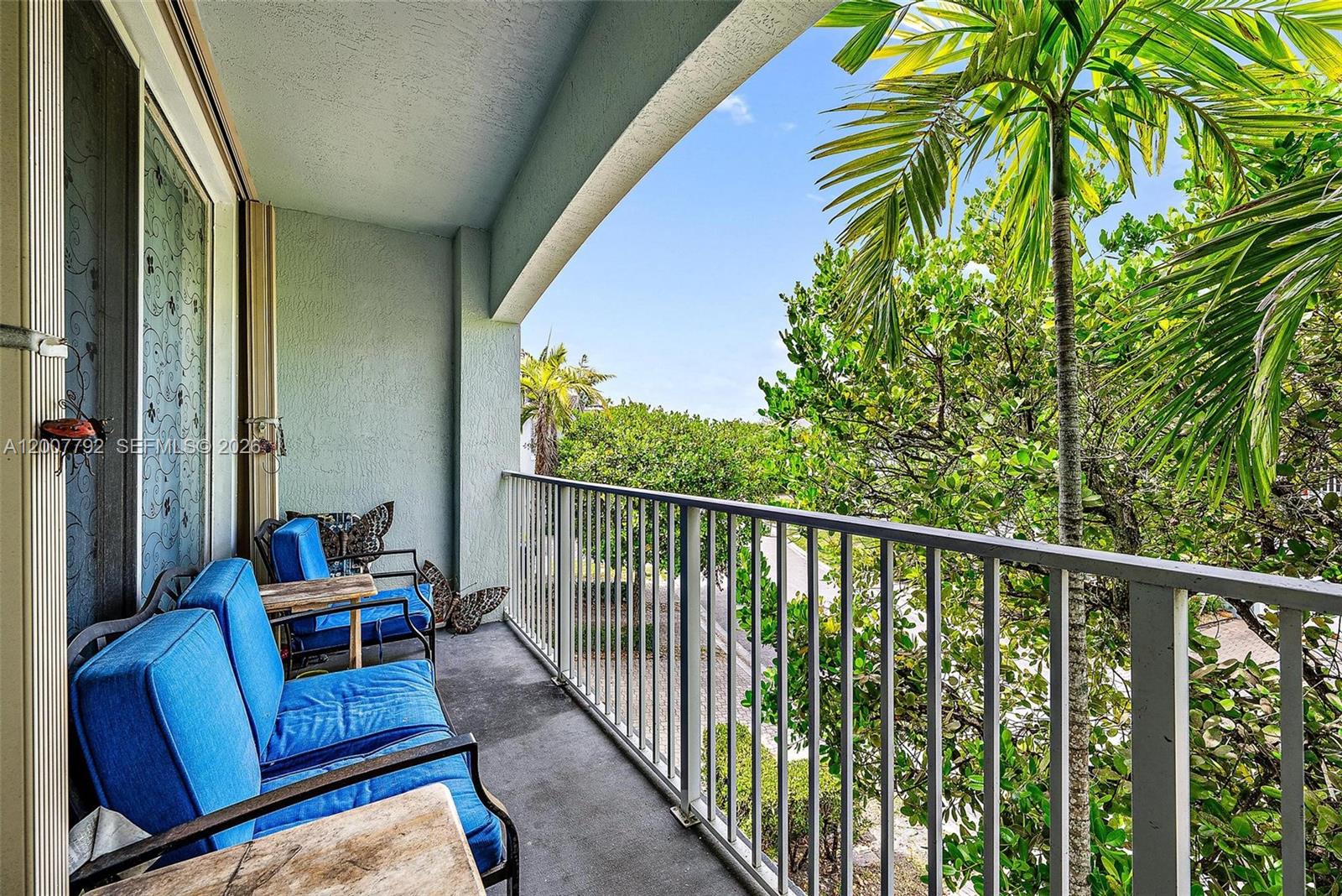 3229 Laurel Ridge Circle, Unit 3229 Riviera Beach, FL 33404 - Photo 14 of 24 a view of a balcony with furniture