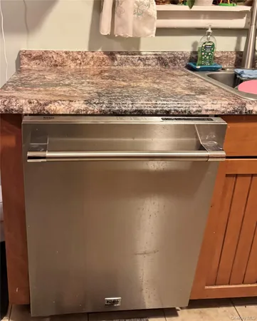 a close view of sink and granite counter top