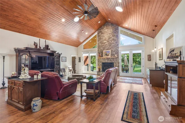a living room with furniture fireplace and flat screen tv
