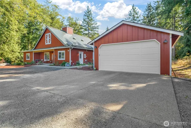 a front view of house with yard and trees