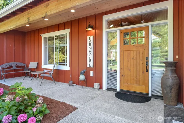 a backyard of a house with outdoor seating