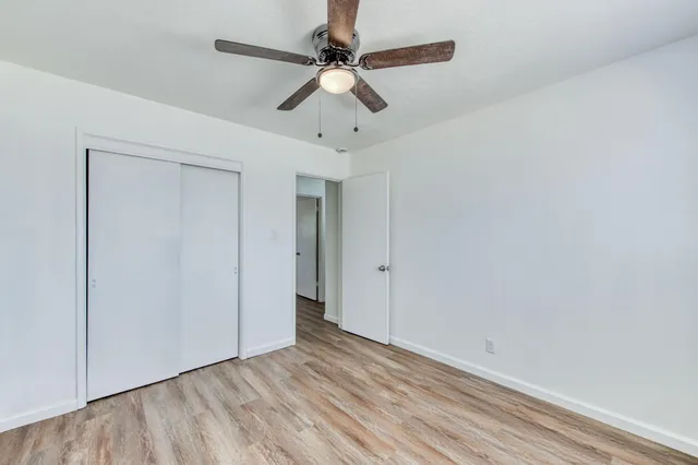 a bathroom with a toilet a sink and shower