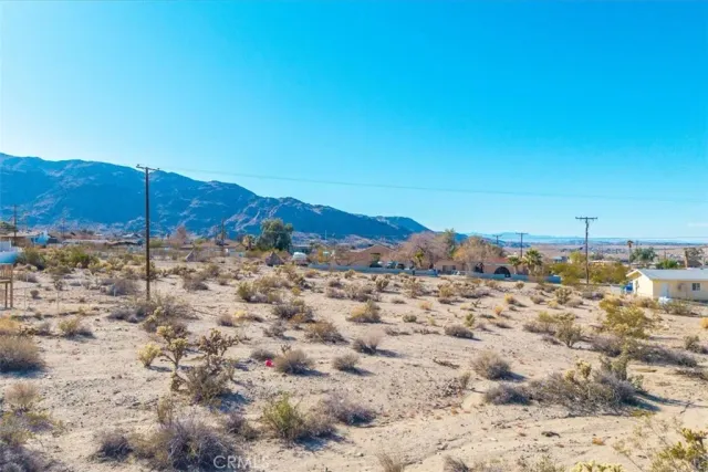 a view of a large building with a mountain in the background