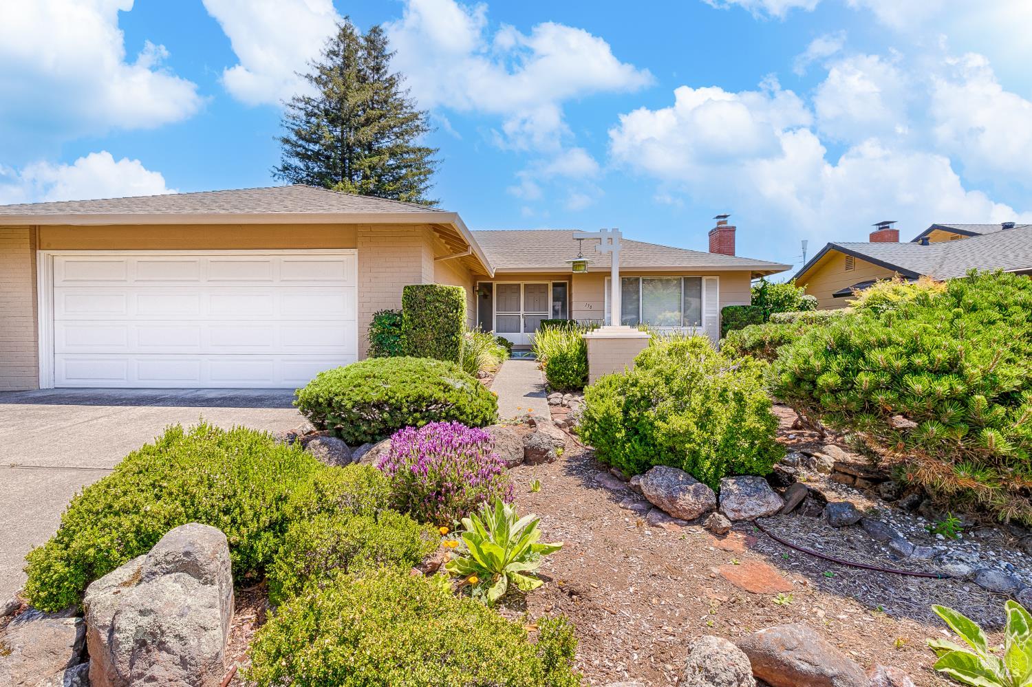 138 Oak Shadow Drive Santa Rosa, CA 95409 - Photo 2 of 50 a front view of a house with a yard and plant in front of it