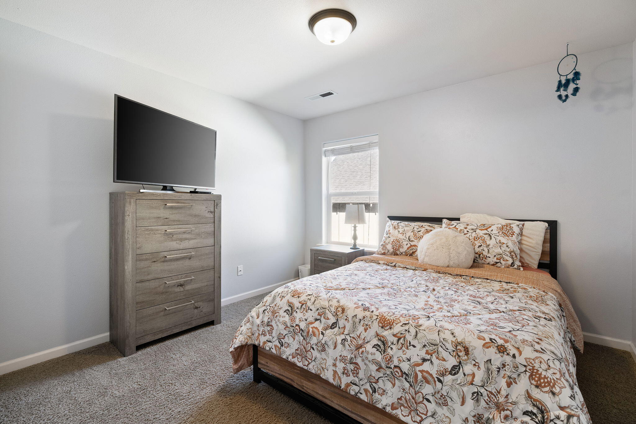 62906 Bilyeu Way Bend, OR 97701 - Photo 22 of 100 a bedroom with a bed and a flat screen tv