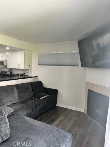 a living room with a couch and a stove