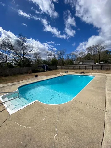 a view of outdoor space and swimming pool