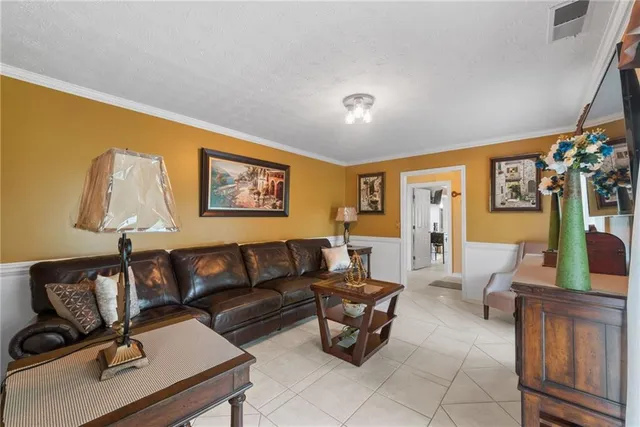 a kitchen with stainless steel appliances granite countertop a stove and a refrigerator