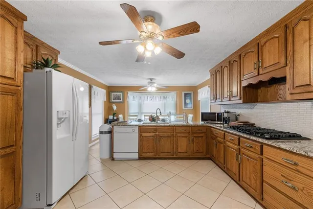 a kitchen with granite countertop lots of counter top space and dining table