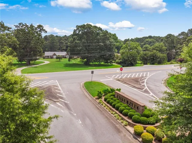 an aerial view of a house with a garden and trees