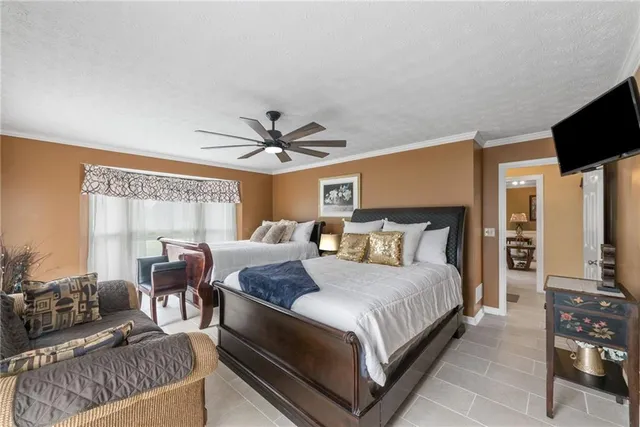a bathroom with a toilet sink tub and mirror