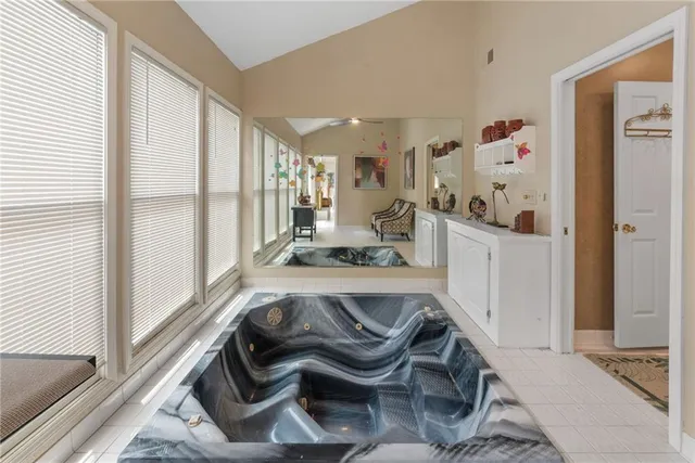 a bedroom with two bed and a ceiling fan