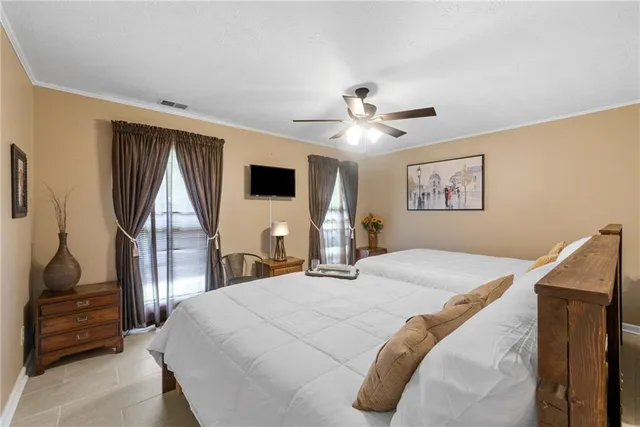 a bathroom with a double vanity sink mirror and toilet