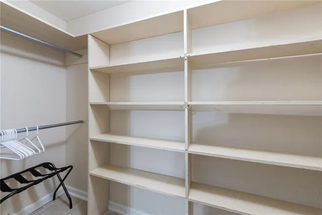 a bedroom with a bed and cabinets